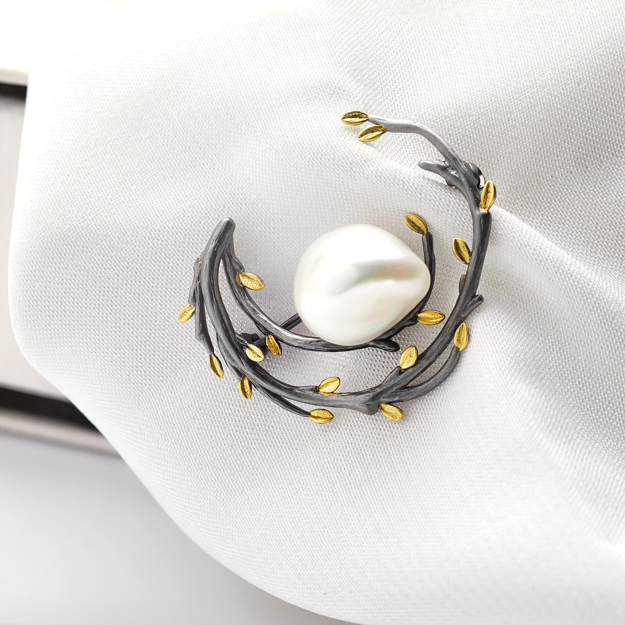 Delicate gold-thread monogram on cuff