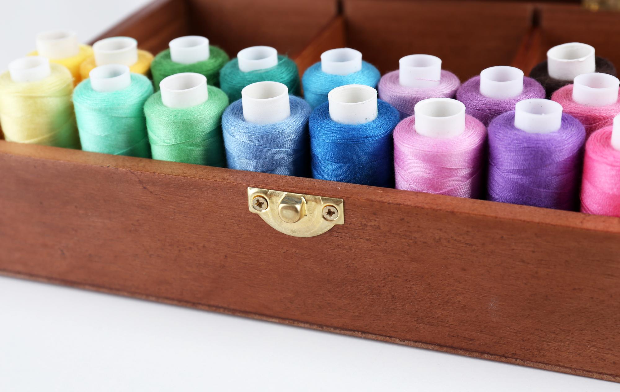Stacked embroidery kits and a printed care guide